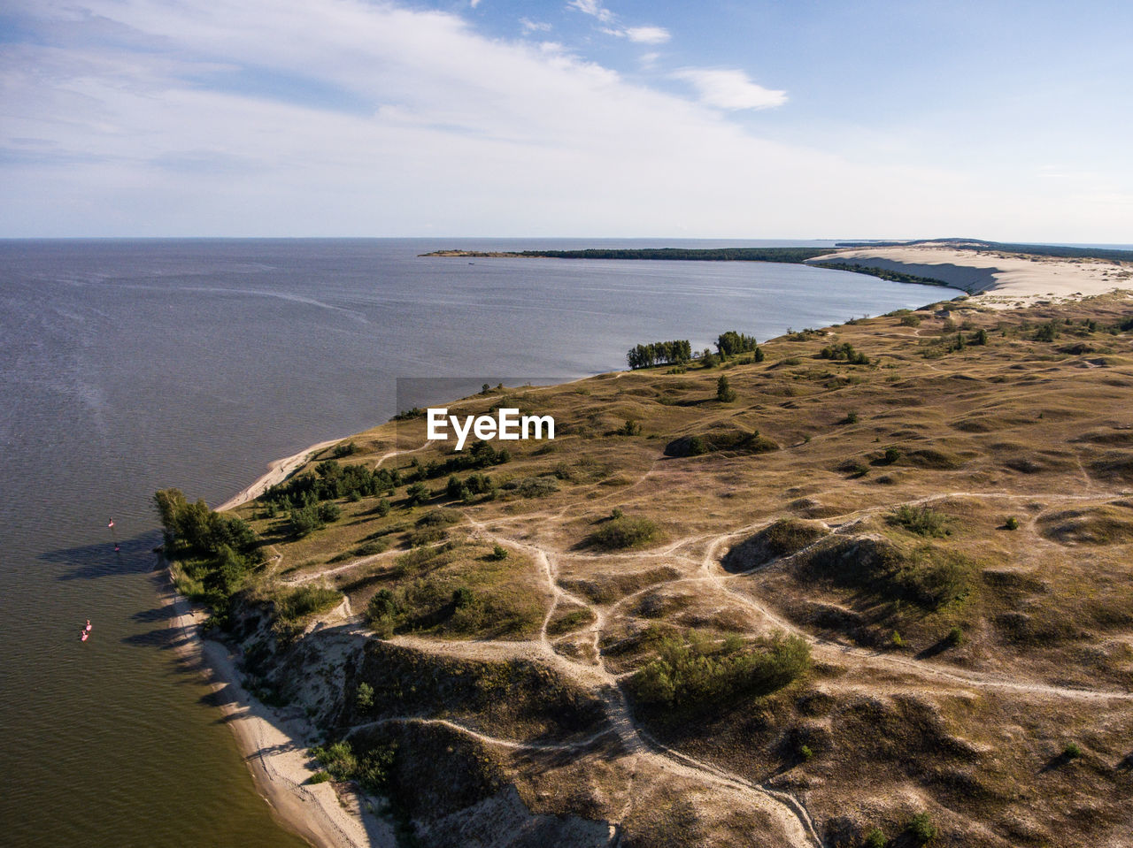 SCENIC VIEW OF SEA AND SHORE AGAINST SKY