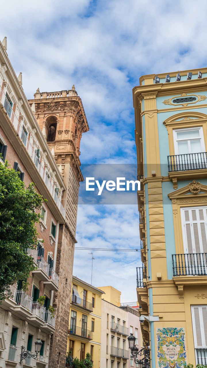 architecture, building exterior, built structure, urban area, building, city, sky, landmark, neighbourhood, town, travel destinations, low angle view, downtown, cloud, nature, cityscape, facade, the past, history, tower, no people, travel, day, residential district, window, tourism, outdoors, street, road