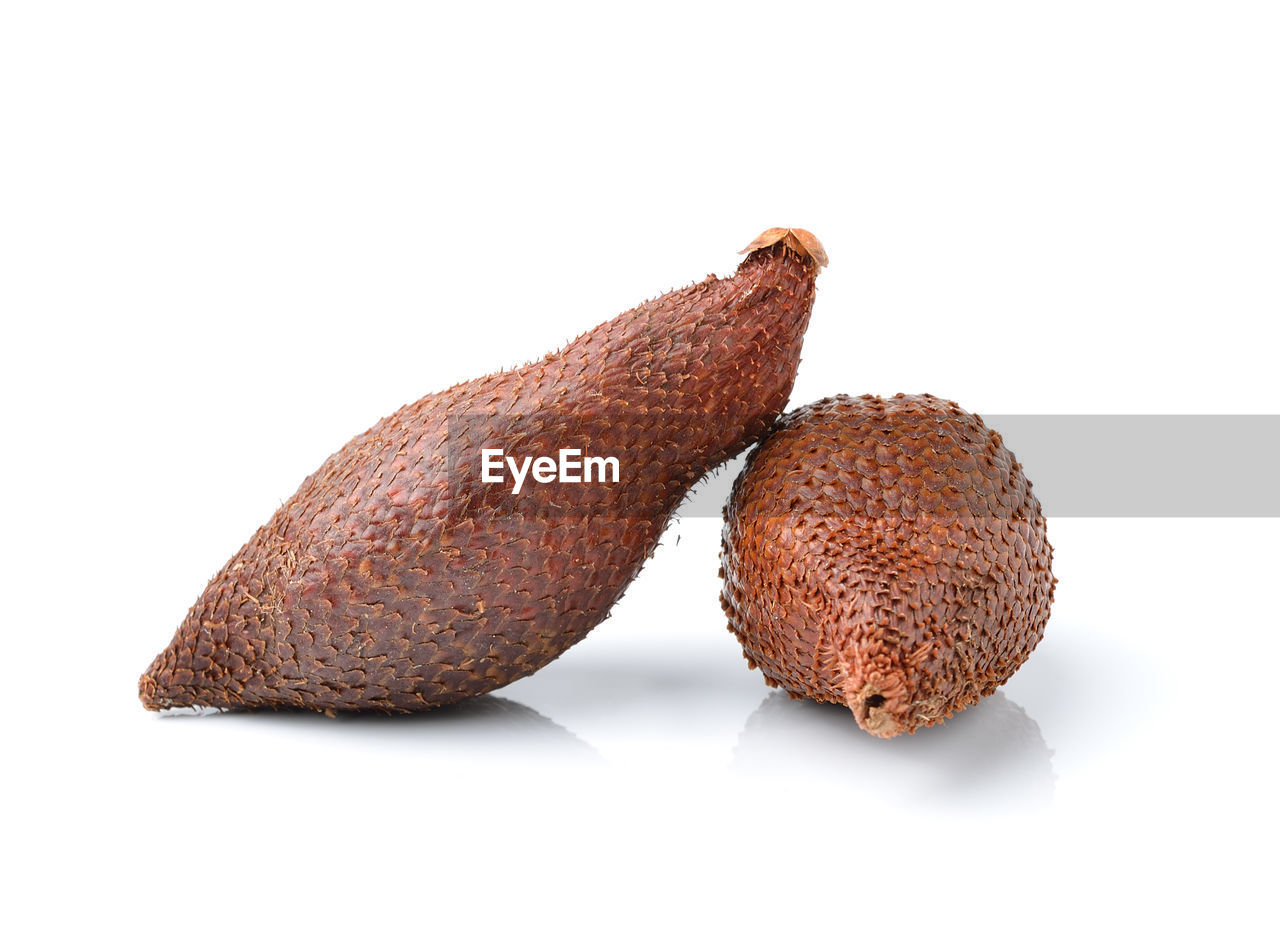 CLOSE-UP OF BANANA ON WHITE BACKGROUND