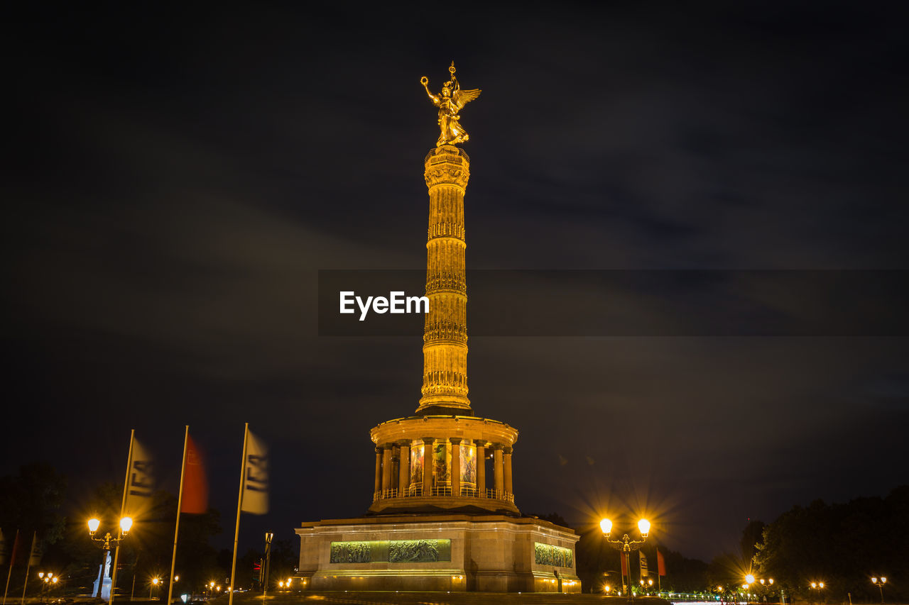 low angle view of eiffel tower against sky at night