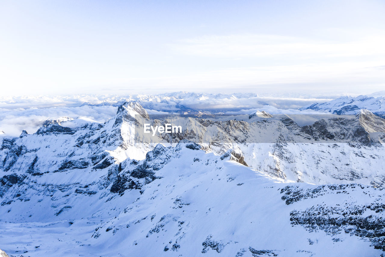 Scenic view of snowcapped mountains against sky