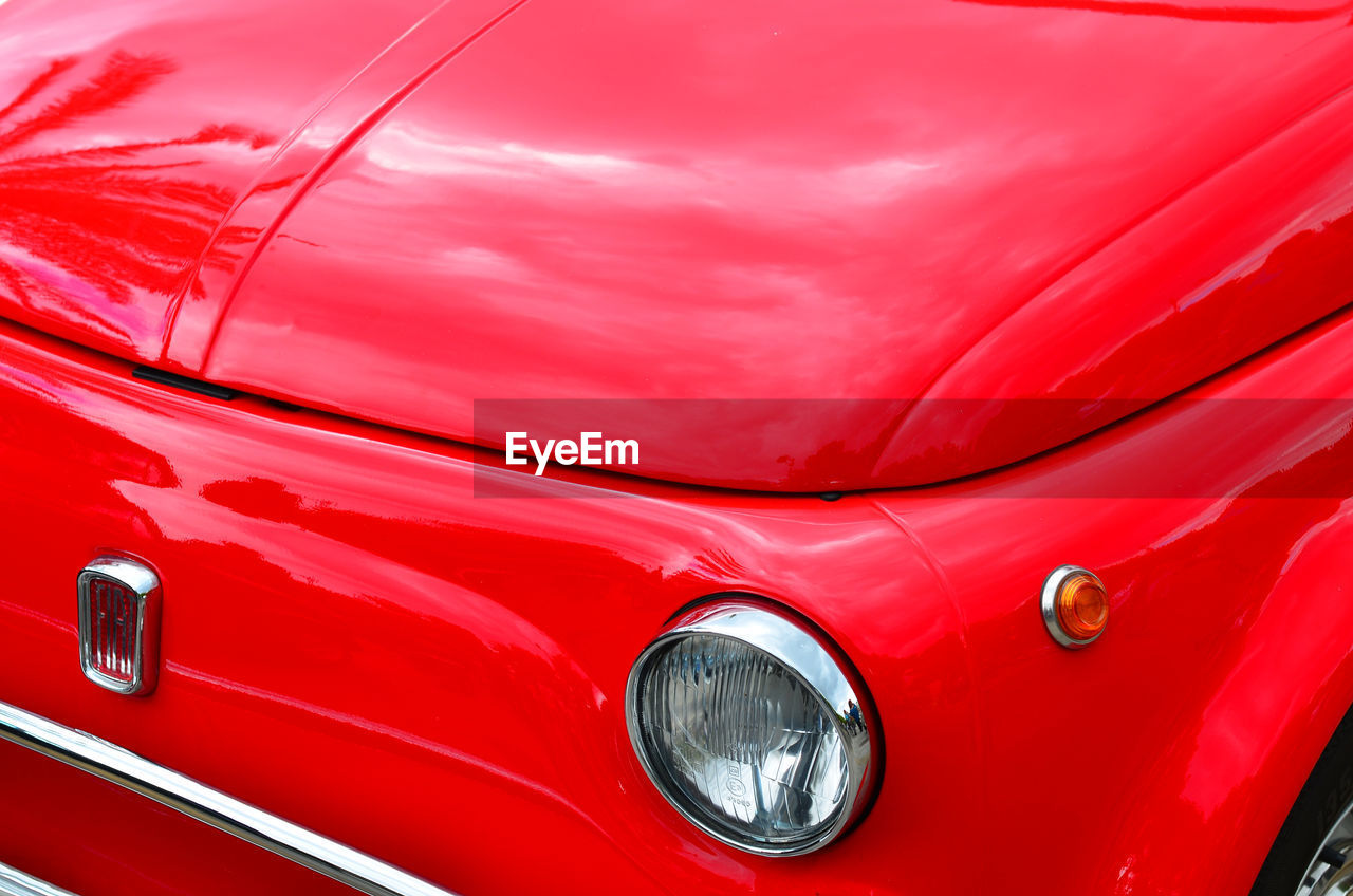 CLOSE-UP OF RED CAR WINDSHIELD