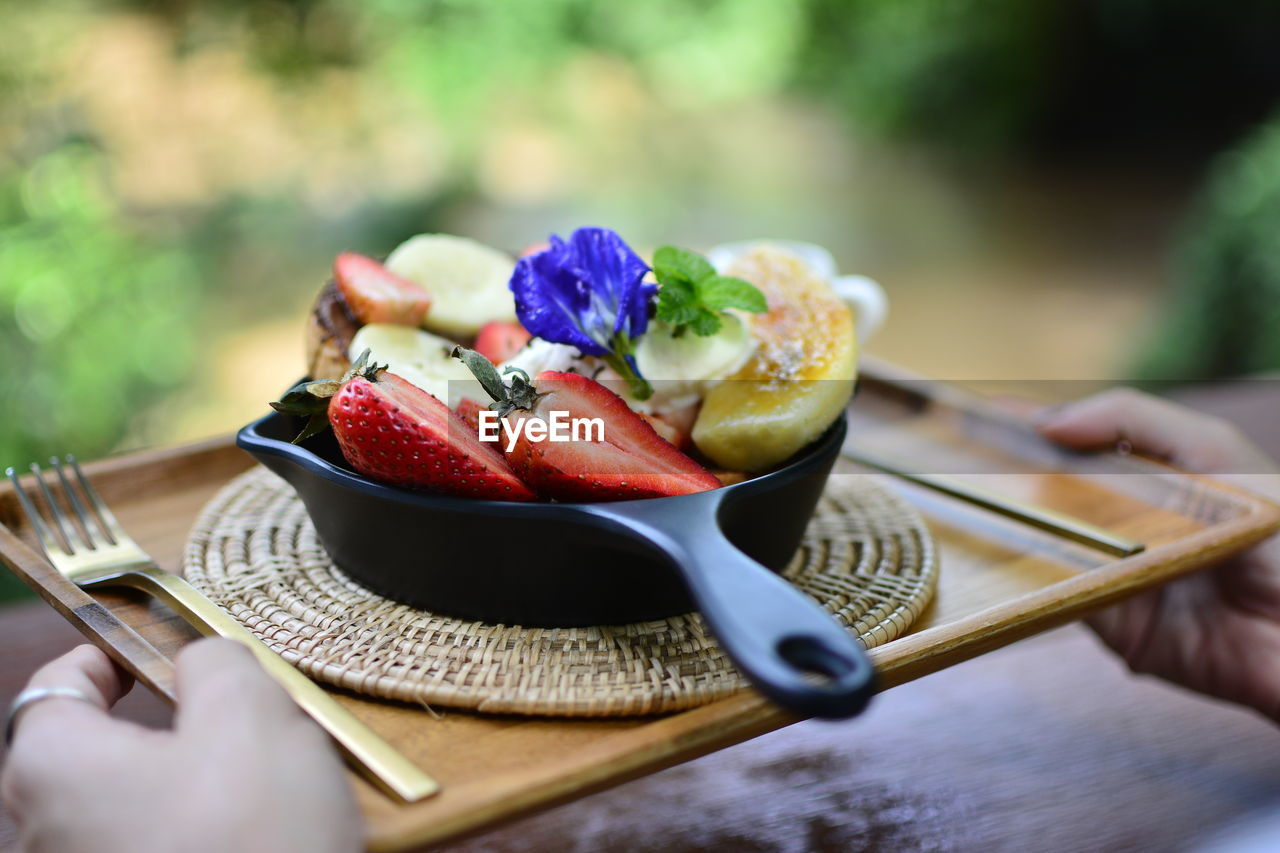 Close-up of fruits in plate on table
