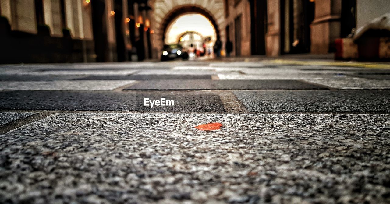 Surface level of road amidst buildings in city