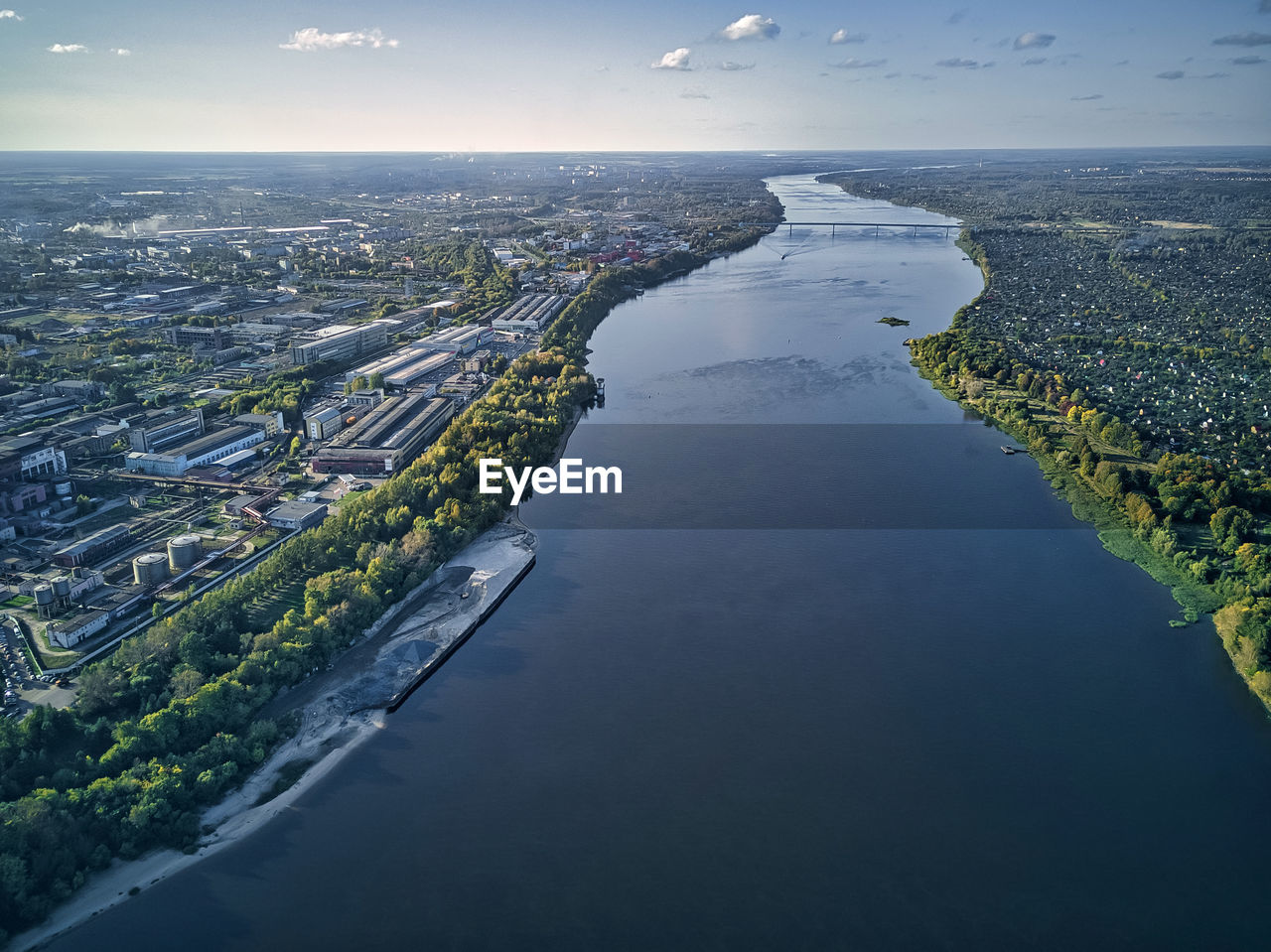 Aerial view of volga river with cityscape against sky