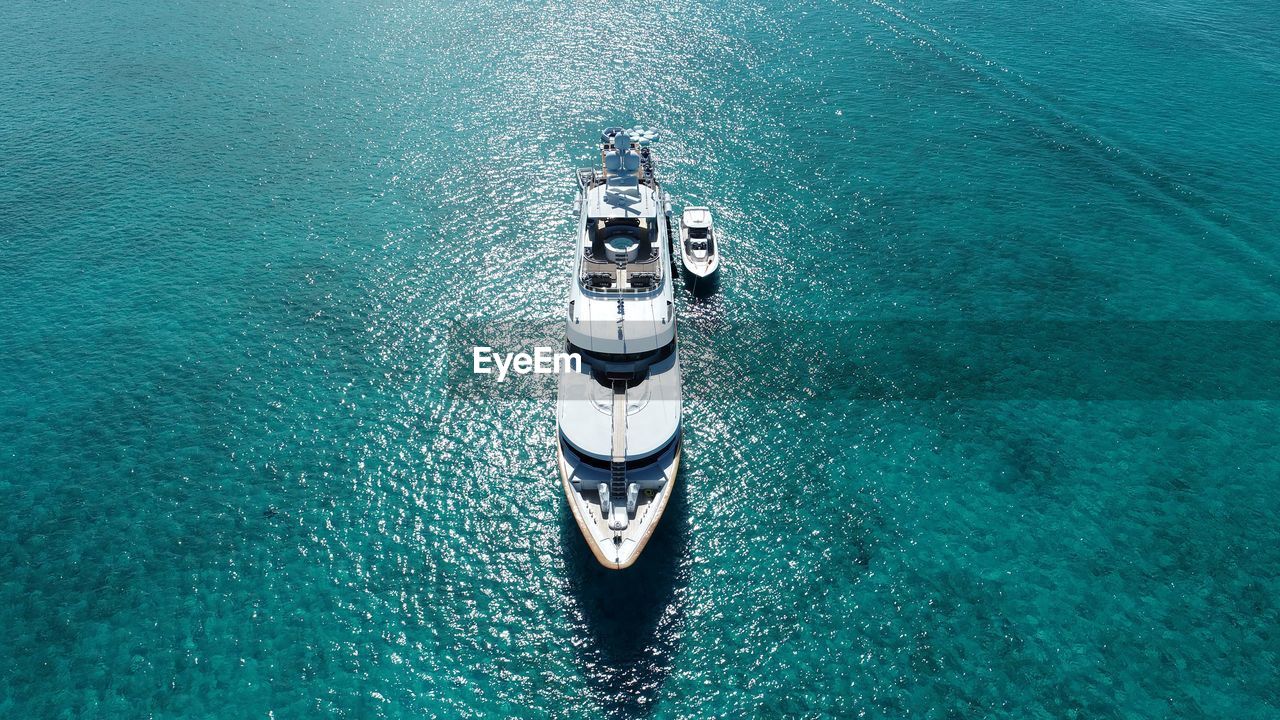 HIGH ANGLE VIEW OF SHIP ON SEA