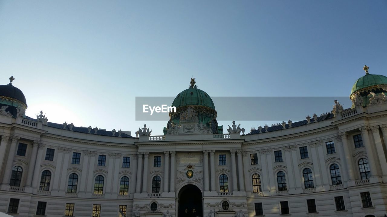 Low angle view of hofburg palace against clear sky