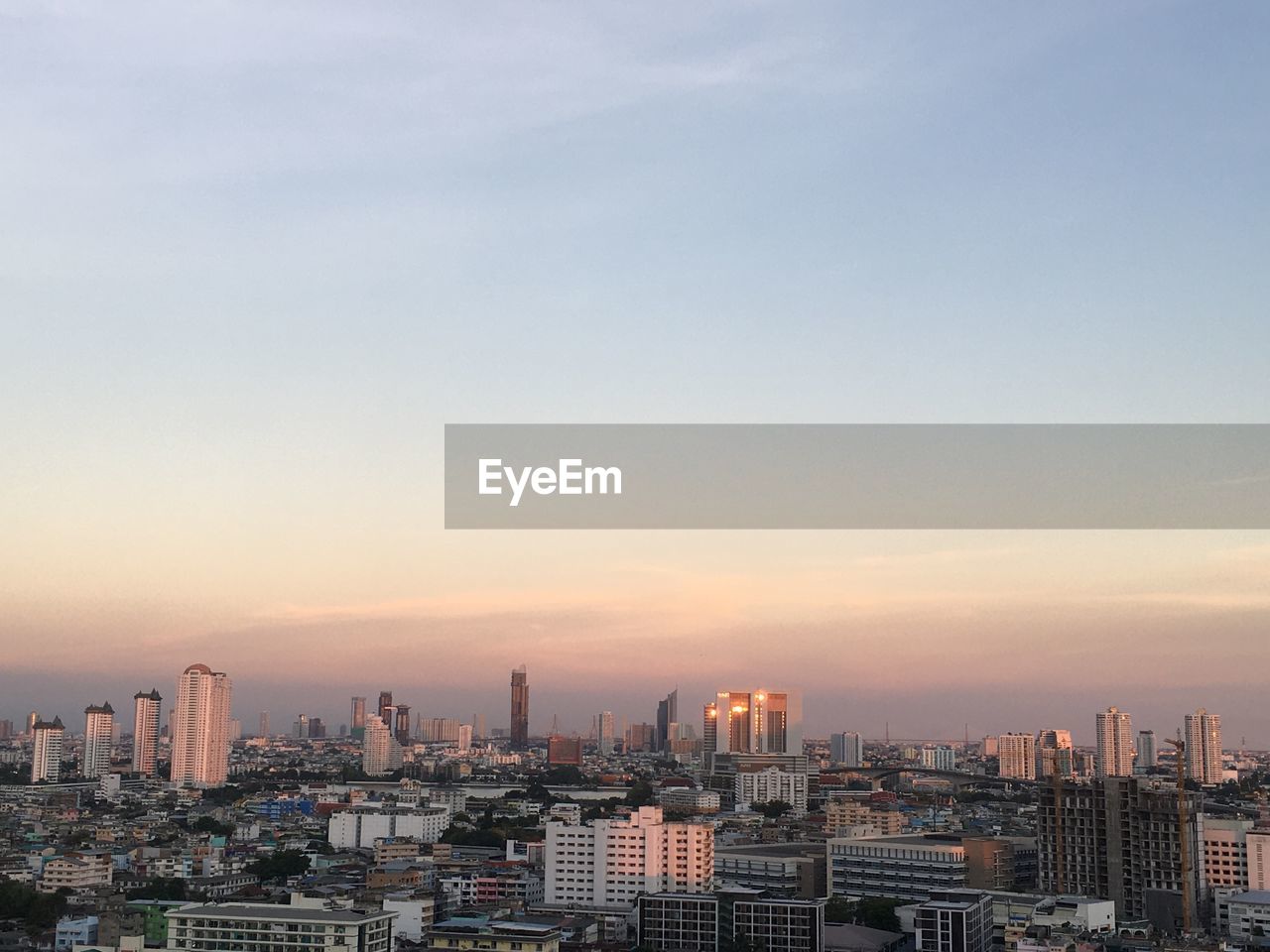 High angle view of buildings against sky during sunset