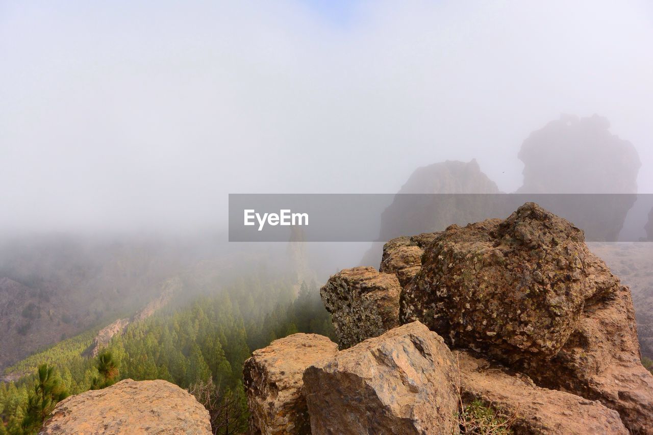 Rocks on mountain against sky