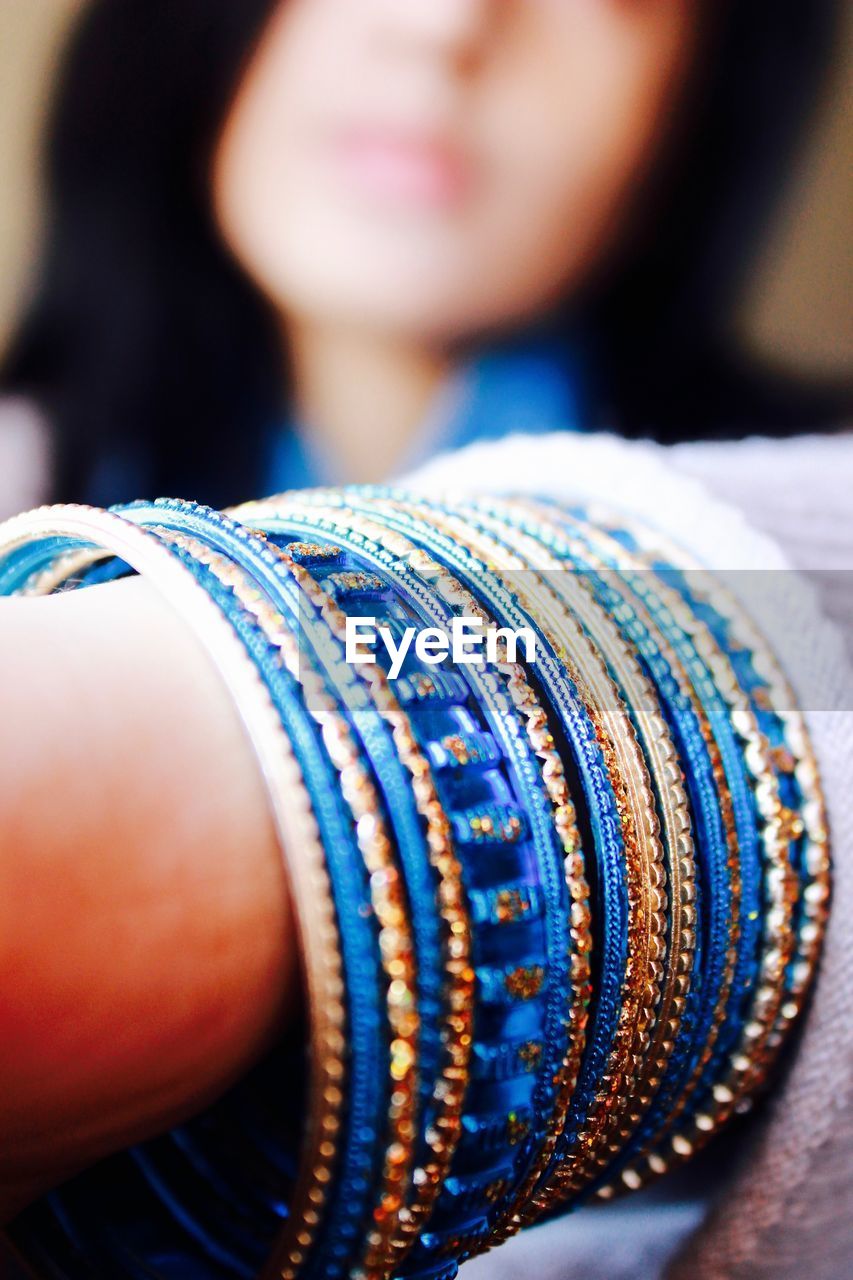 Close-up of hand wearing bangles