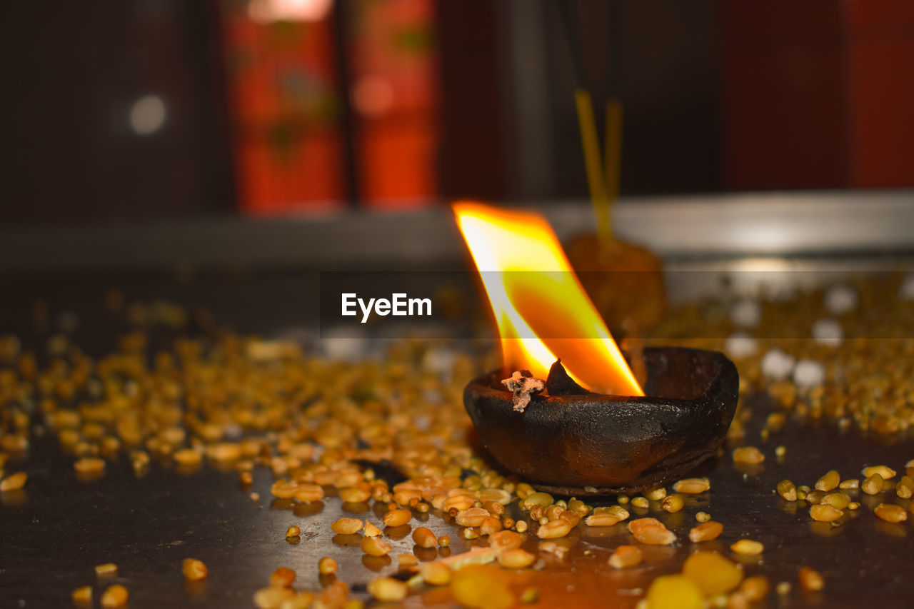 Close-up of diya in temple