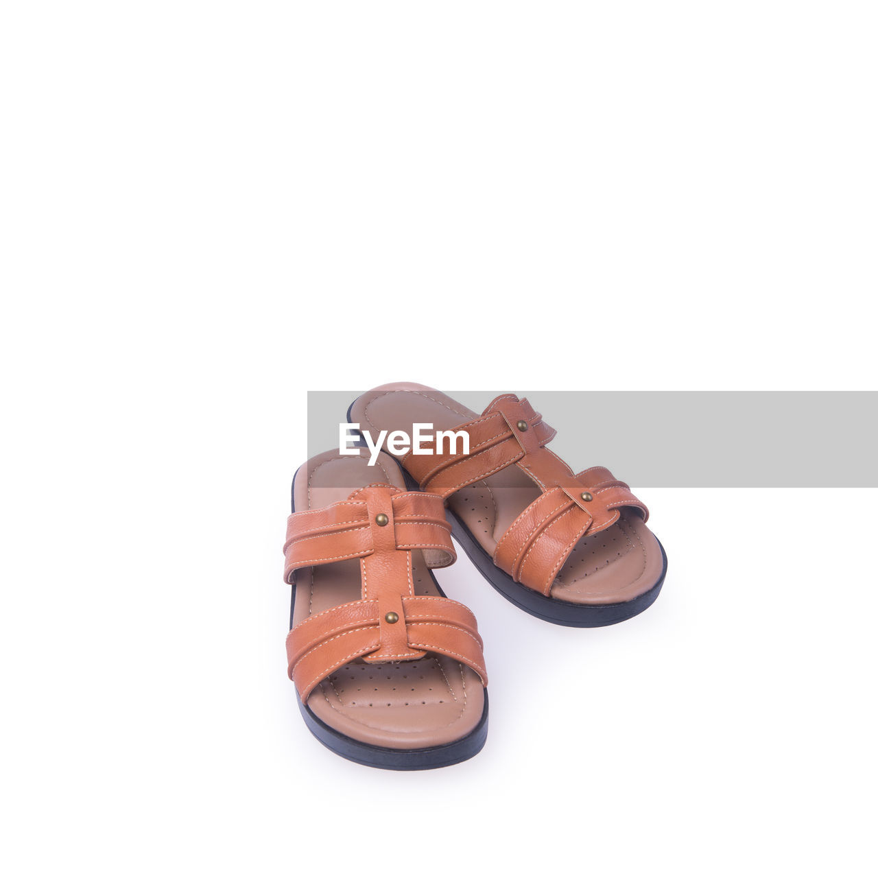 Close-up of sandals against white background