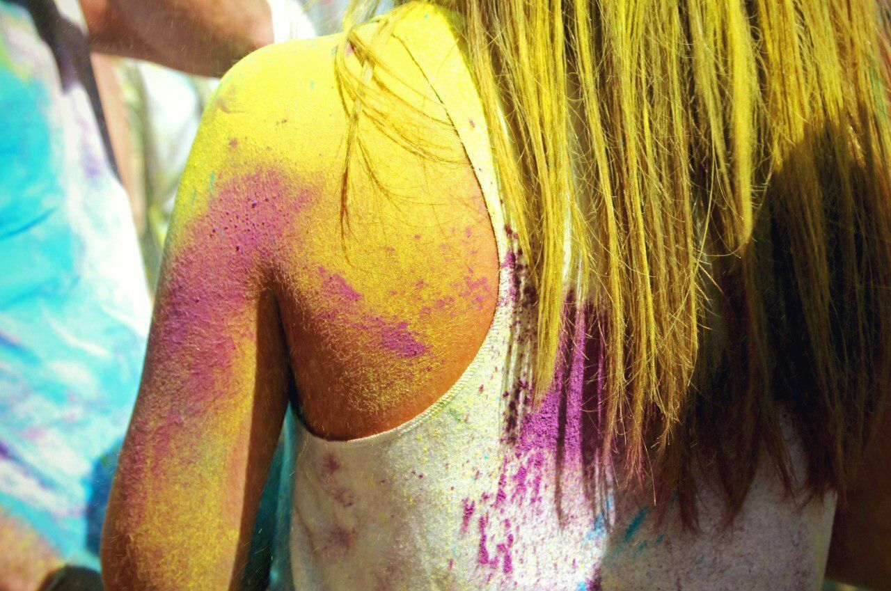 Midsection of woman during holi festival