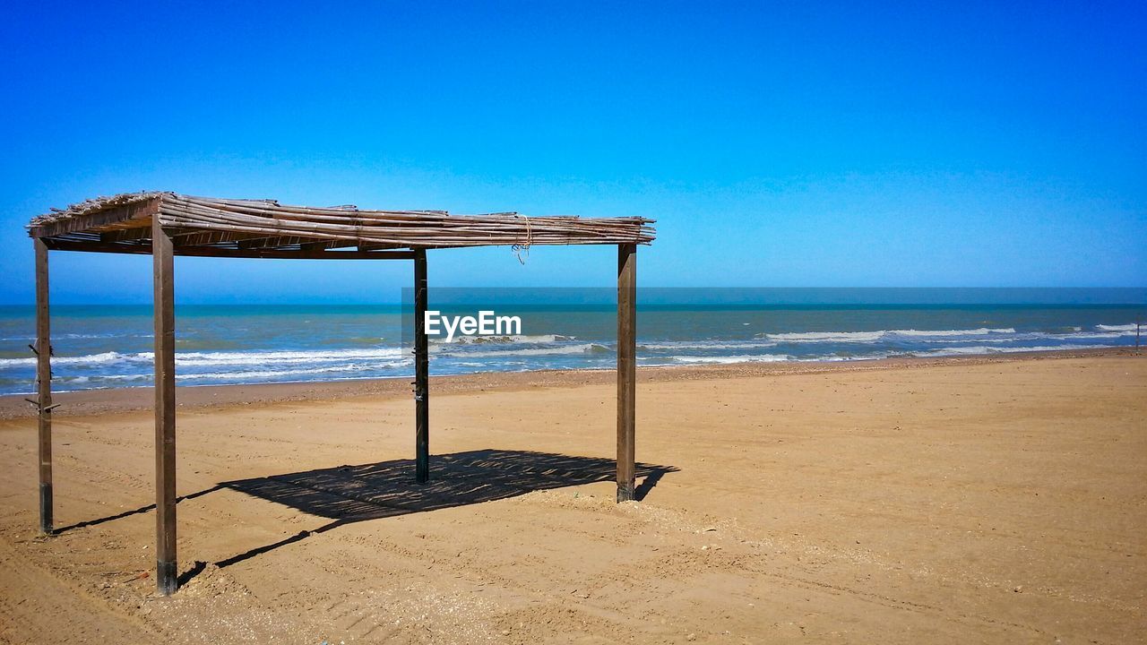 Built structure at beach against clear sky