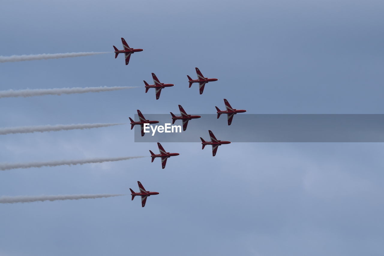 LOW ANGLE VIEW OF AIRSHOW IN FLIGHT