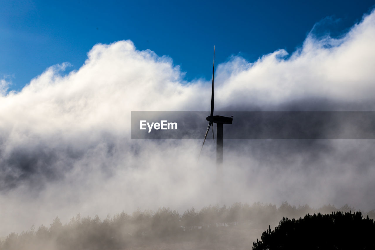 LOW ANGLE VIEW OF SILHOUETTE OF WIND TURBINE AGAINST SKY