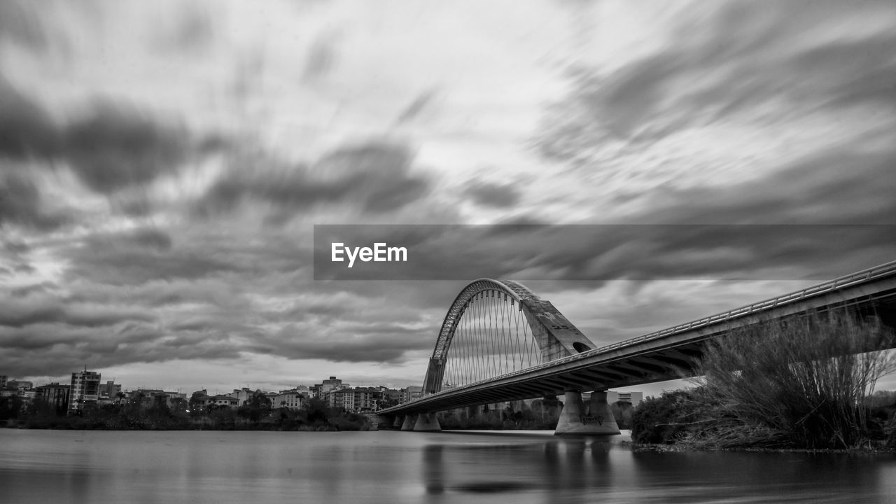 VIEW OF BRIDGE OVER RIVER AGAINST SKY