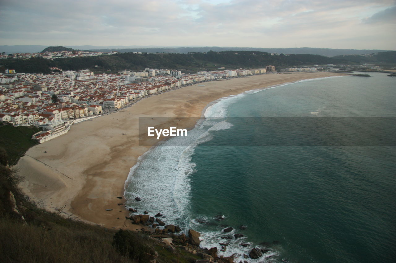 High angle view of townscape by beach