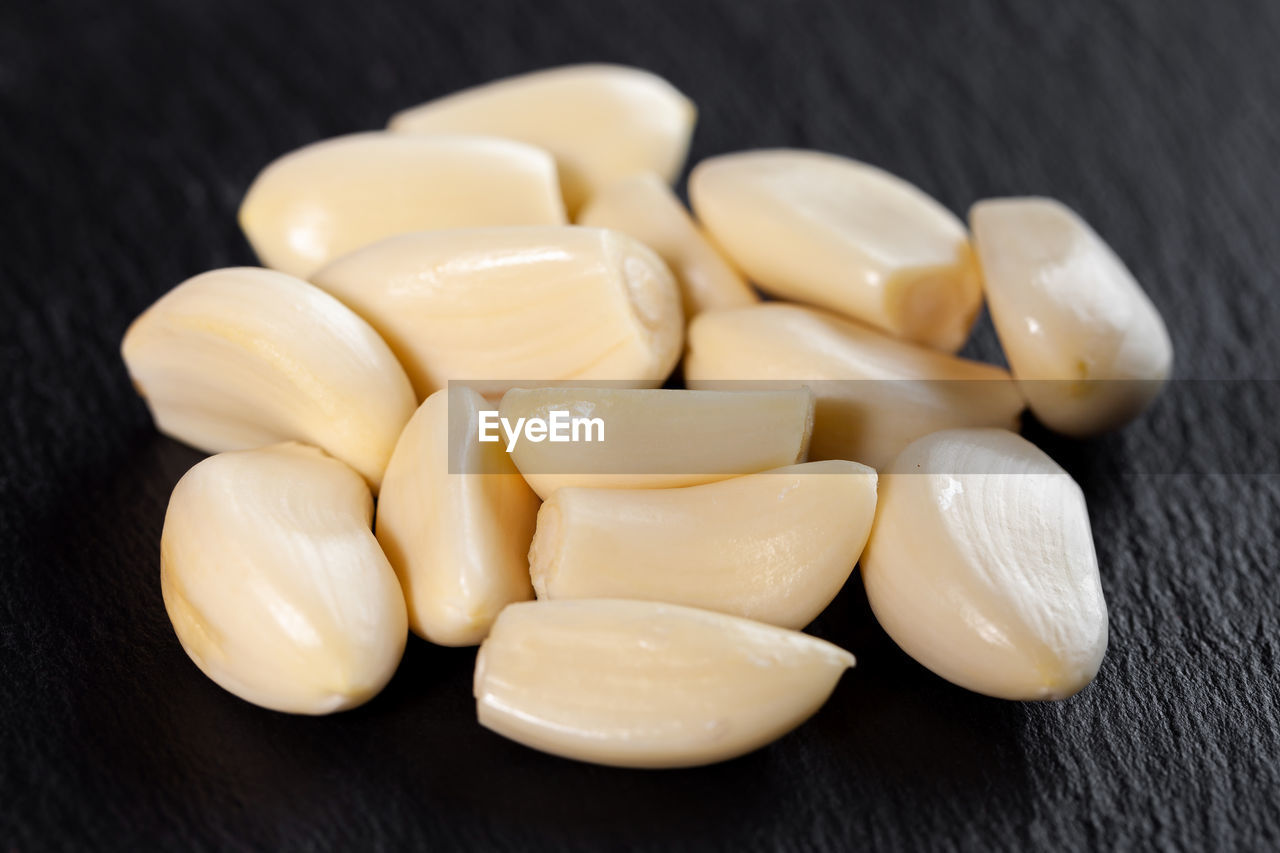 food, food and drink, wellbeing, freshness, healthy eating, indoors, close-up, plant, no people, still life, garlic, produce, ingredient, studio shot, vitamin, healthcare and medicine, vegetable, snack, medicine, nutritional supplement, large group of objects, table, asian food