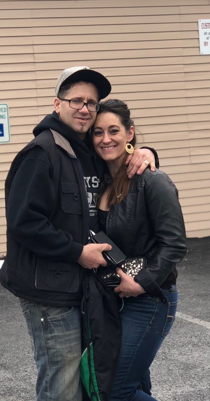 Portrait of smiling couple standing outdoors