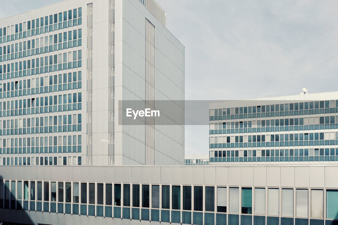 Low angle view of modern building against sky in city