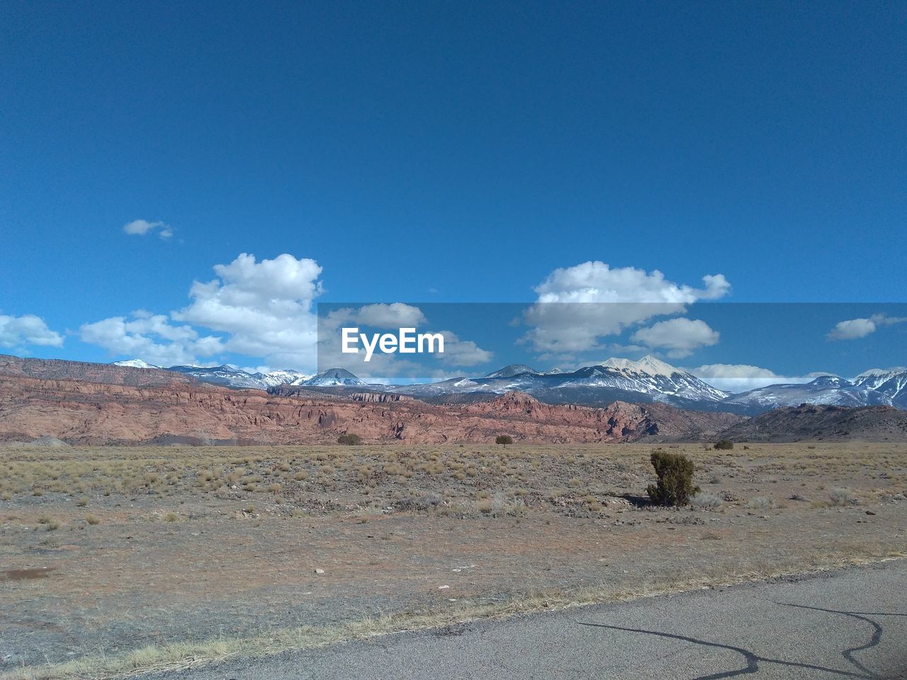 SCENIC VIEW OF ARID LANDSCAPE AGAINST SKY