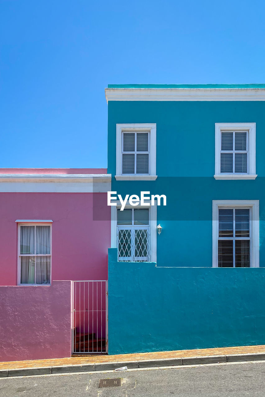 Colorful facades of old houses in pink and blue, bo kaap malay quarter, cape town, south africa