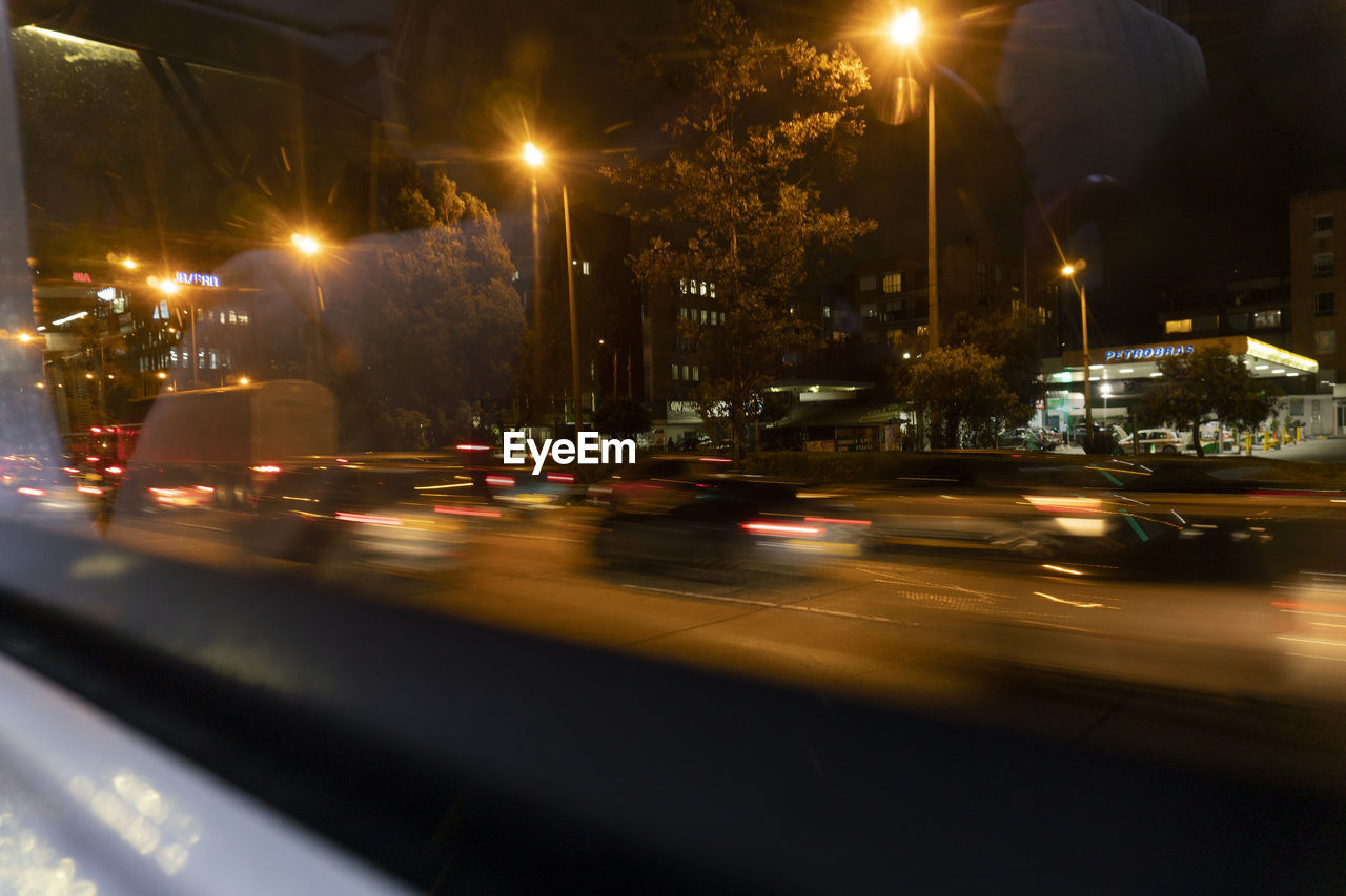 VIEW OF CITY STREET AT NIGHT