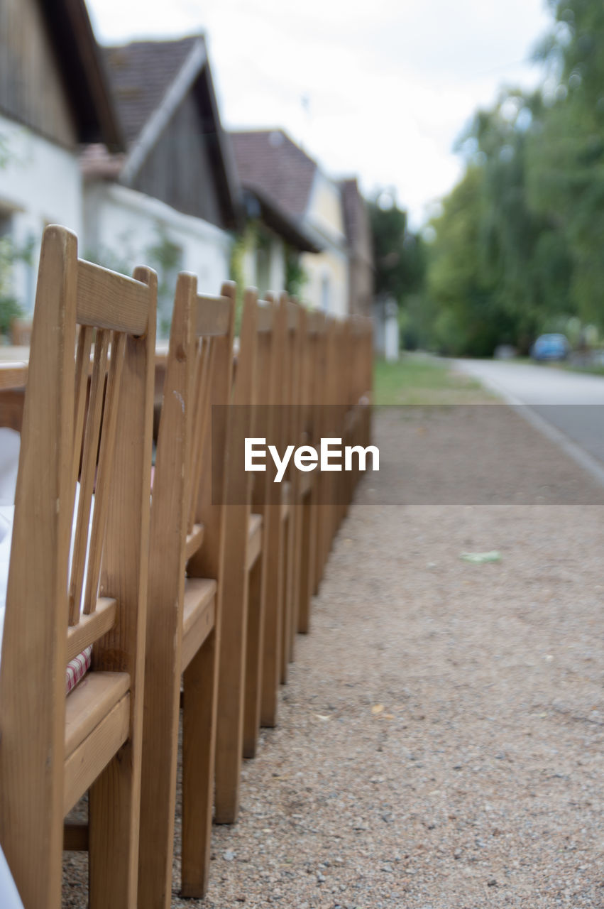 wood, architecture, fence, no people, day, nature, focus on foreground, built structure, outdoors, outdoor structure, home fencing, in a row, plant, building, sky, building exterior