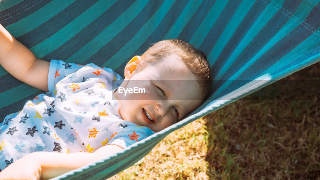 High angle view of boy sleeping