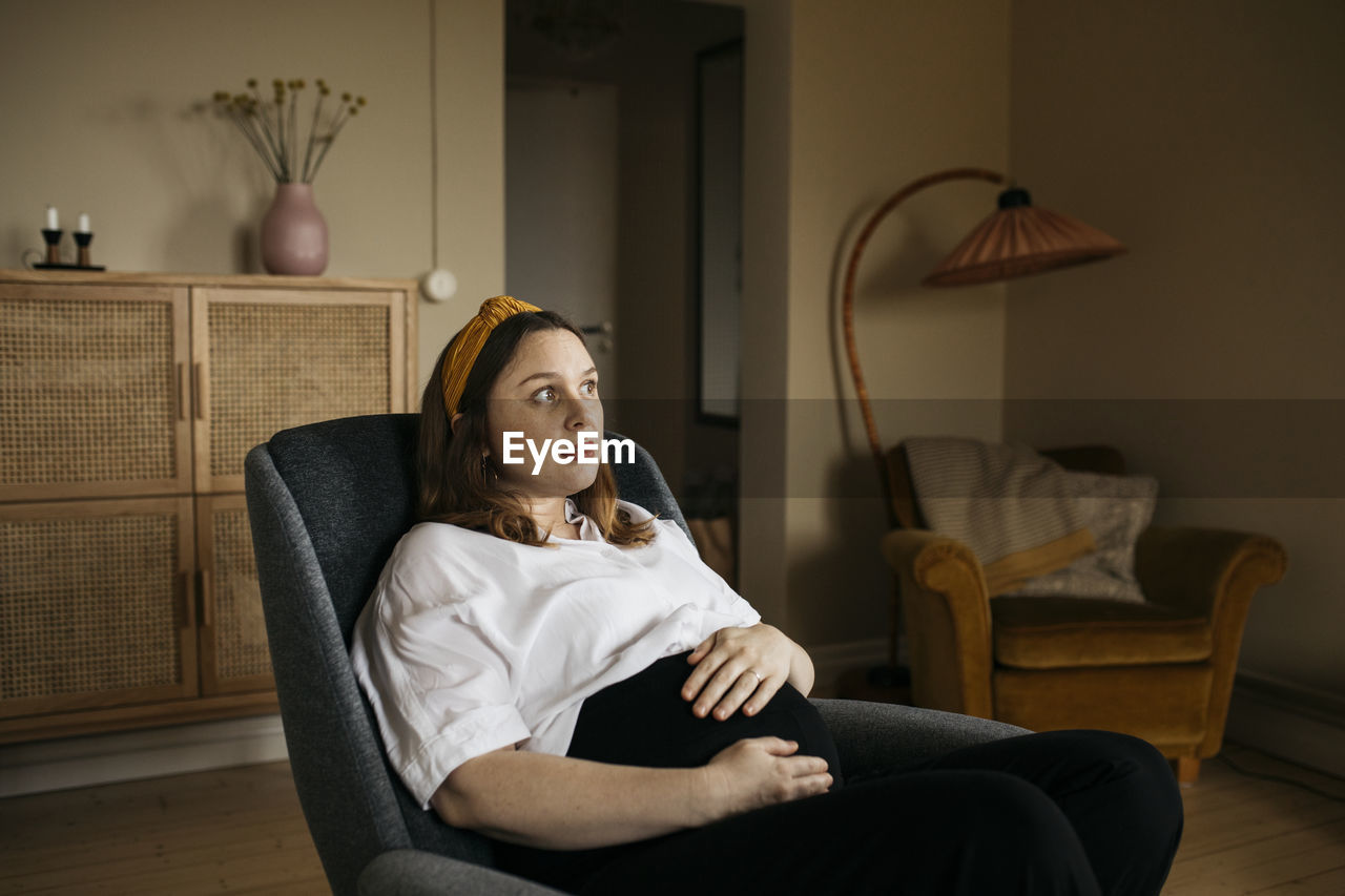 Pregnant woman resting in chair