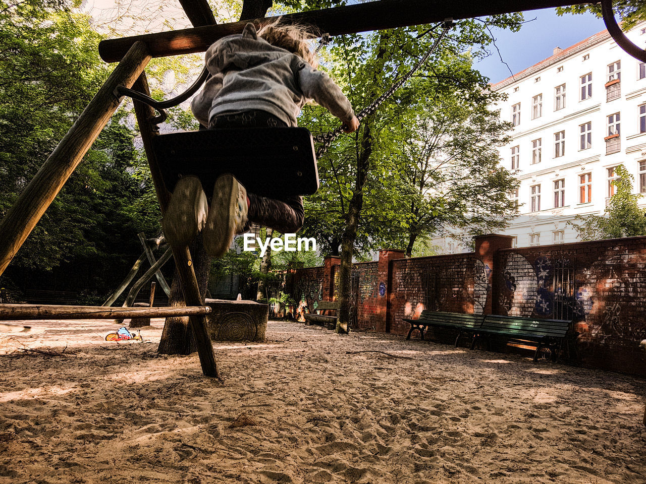 LOW ANGLE VIEW OF MAN AGAINST TREES