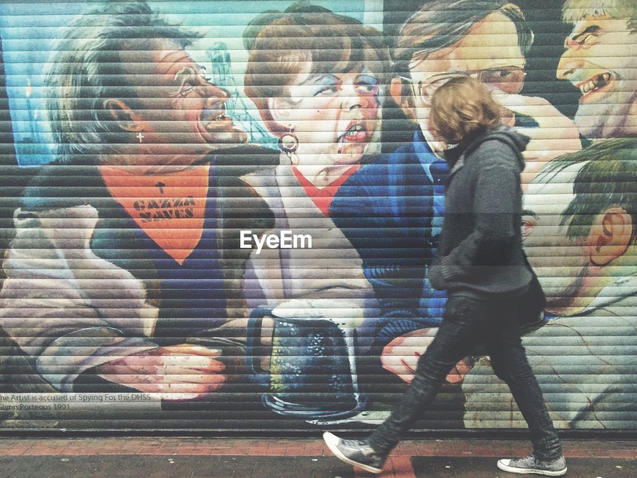 CLOSE-UP OF WOMAN STANDING ON WALL