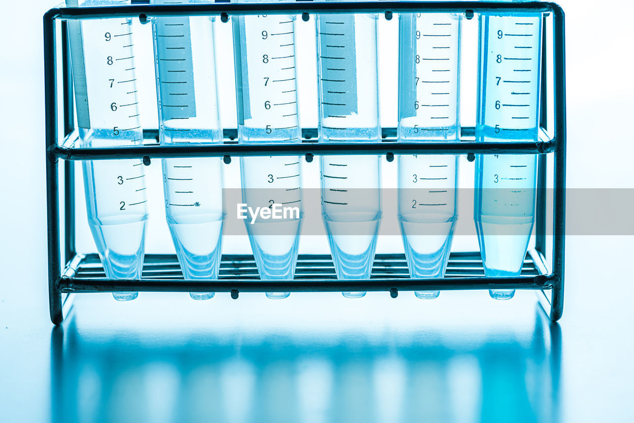 Close-up of test tubes against white background