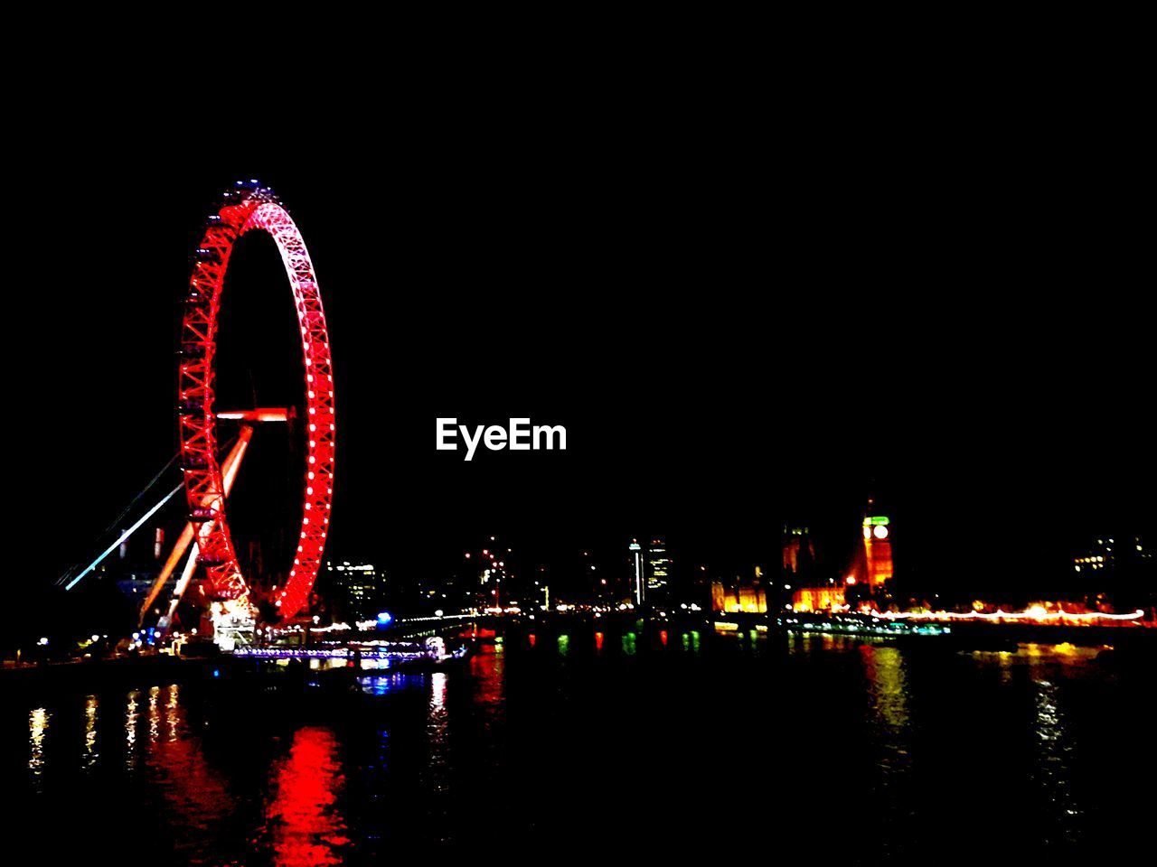 ILLUMINATED FERRIS WHEEL AT NIGHT