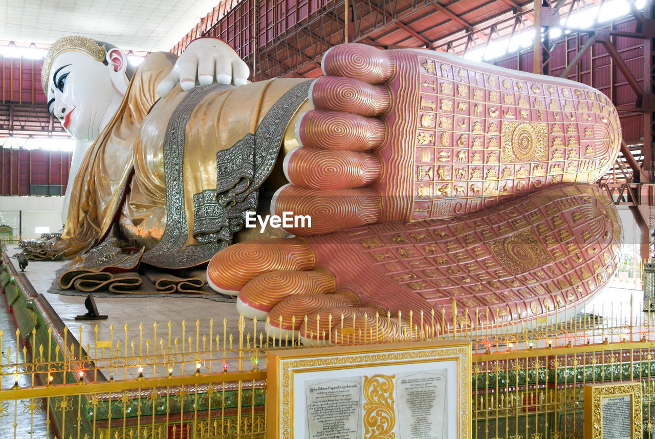 LOW ANGLE VIEW OF BUDDHA STATUE AGAINST THE SKY