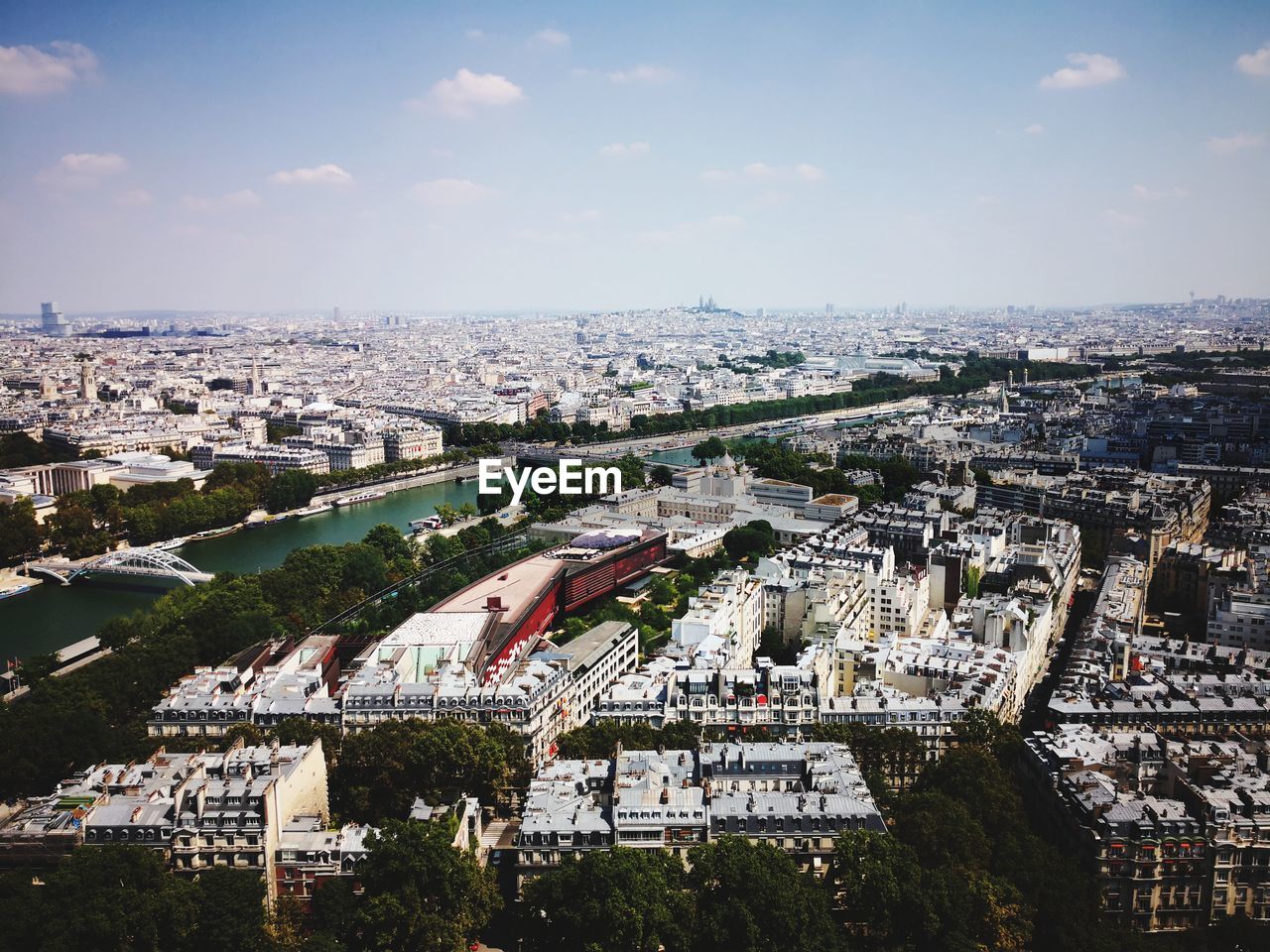 HIGH ANGLE VIEW OF BUILDINGS AGAINST SKY