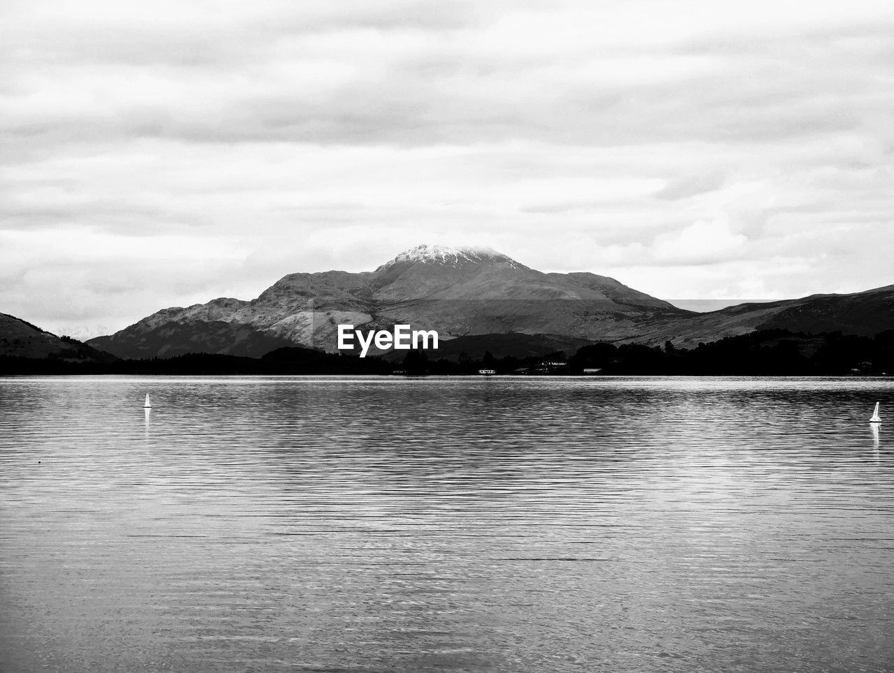 mountain, water, black and white, mountain range, scenics - nature, lake, monochrome photography, sky, monochrome, beauty in nature, cloud, reflection, tranquil scene, tranquility, nature, no people, horizon, environment, landscape, day, body of water, non-urban scene, land, travel destinations, outdoors, black, reservoir, white, remote, travel