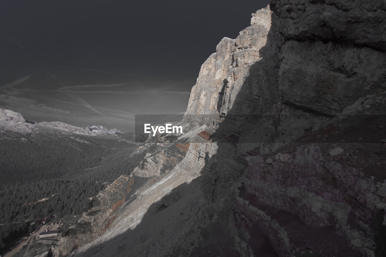 Scenic view of snowcapped mountains against sky at night