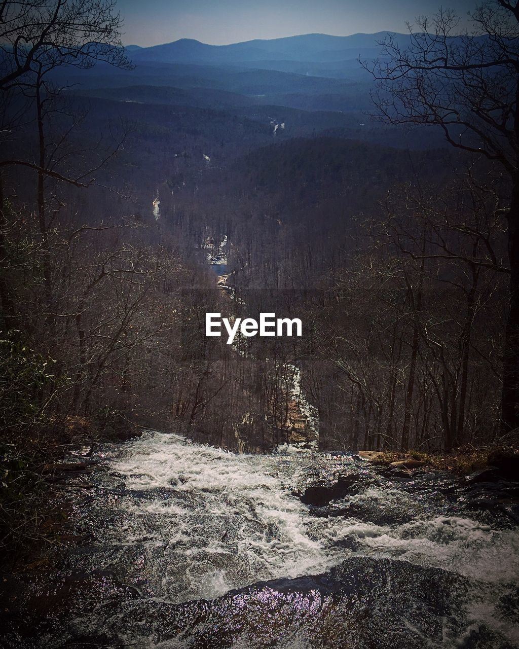 SCENIC VIEW OF RIVER WITH MOUNTAIN IN BACKGROUND
