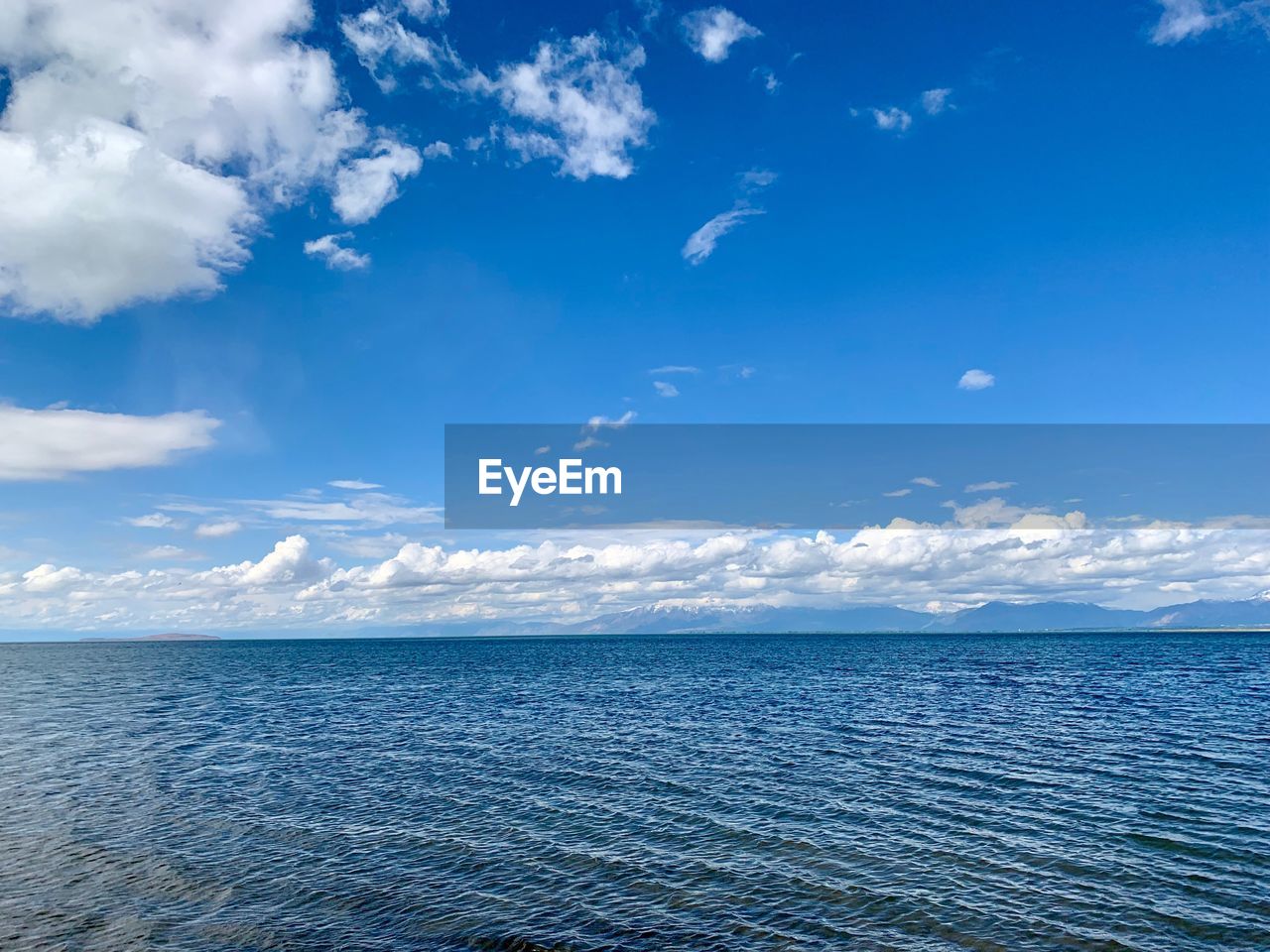 Scenic view of sea against blue sky