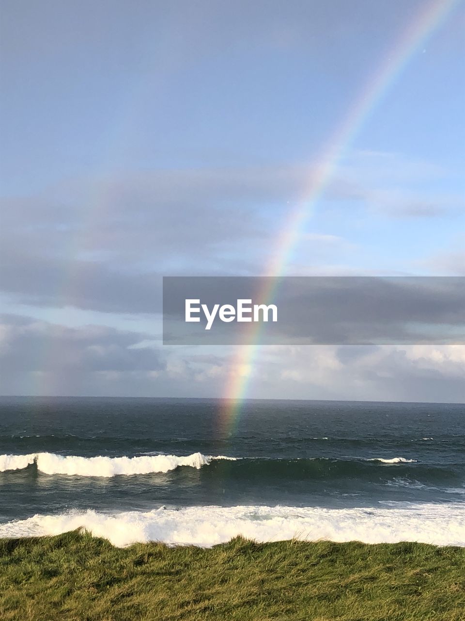 SCENIC VIEW OF RAINBOW OVER SEA
