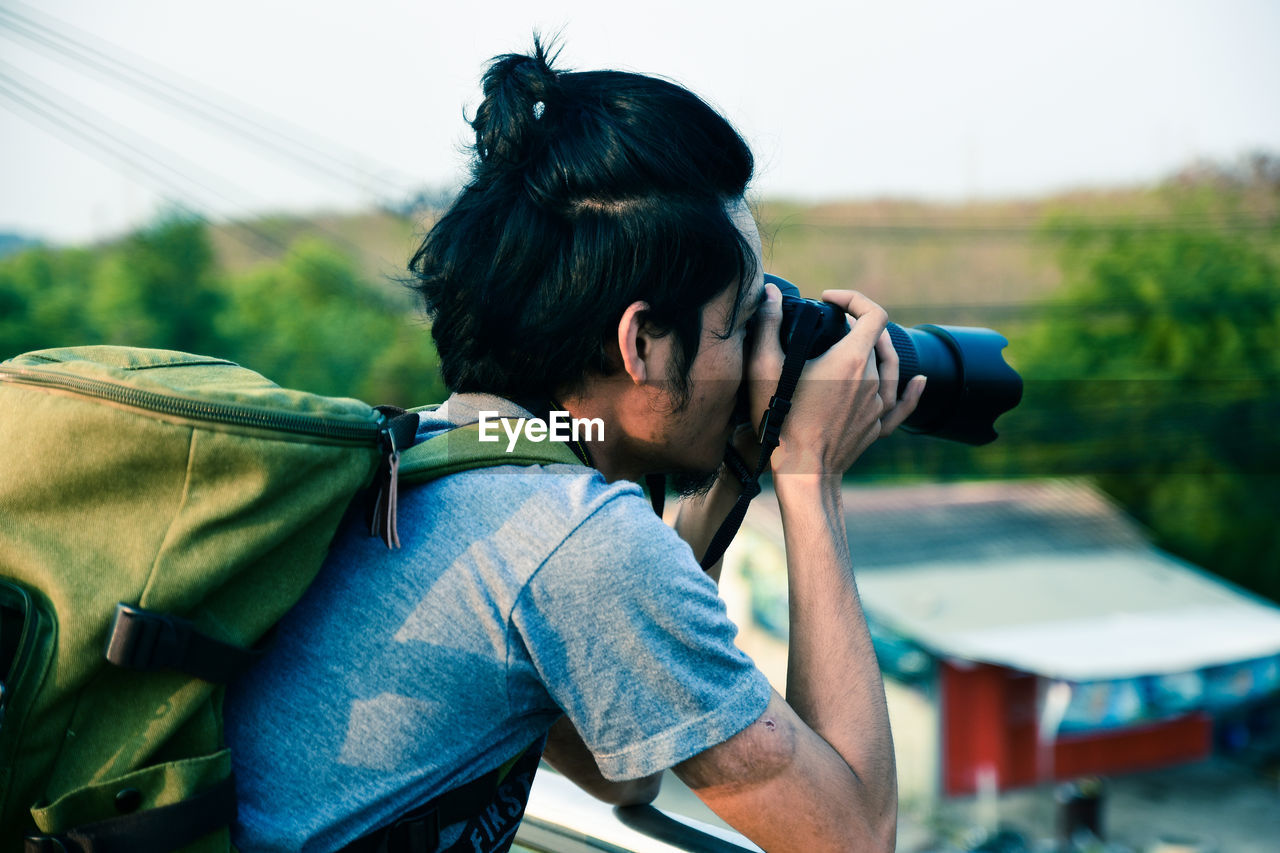 MAN PHOTOGRAPHING