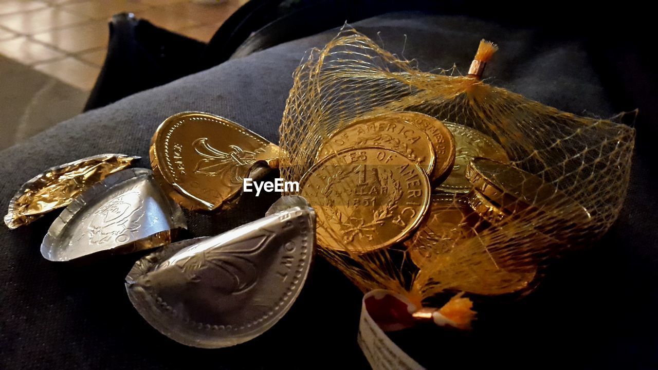 High angle view of chocolate coins at table