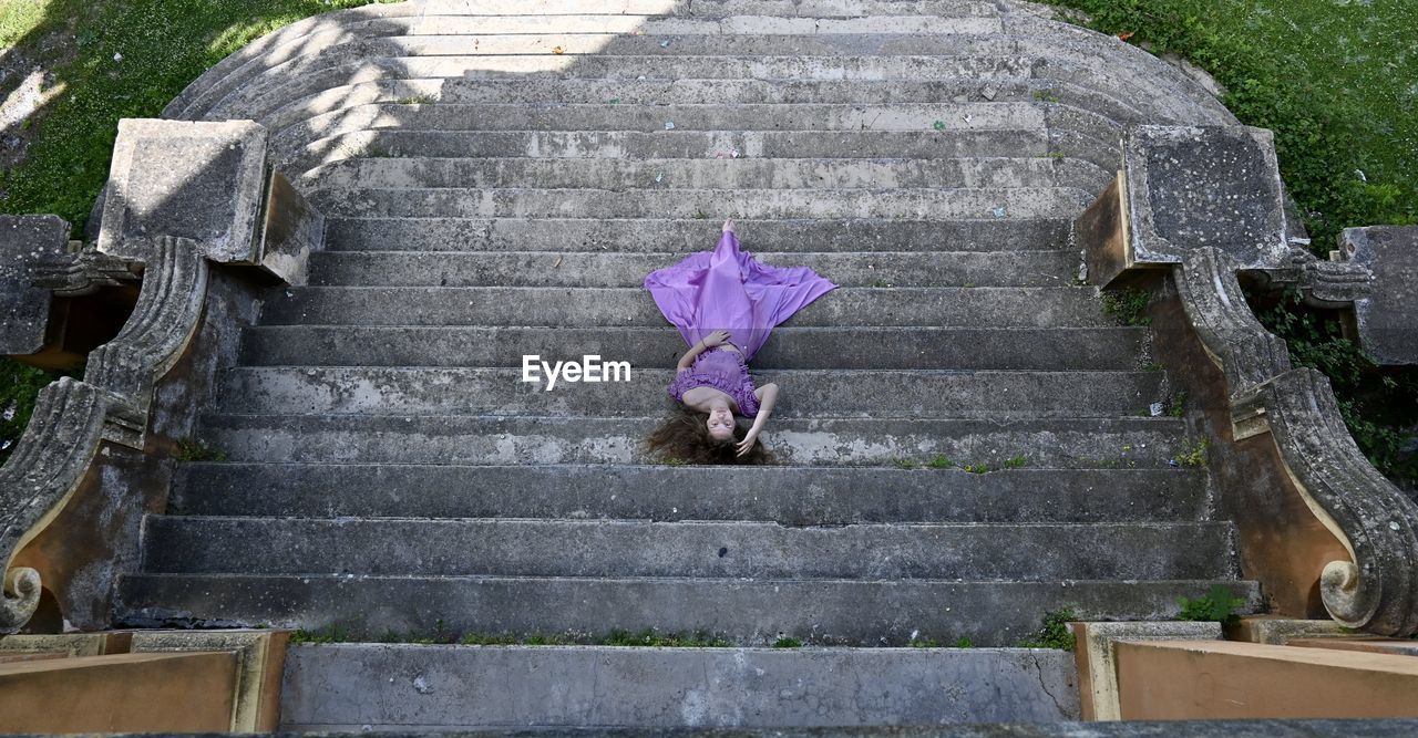 Girl lying down on steps