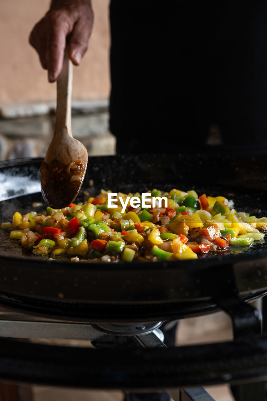 cropped hand of person preparing food