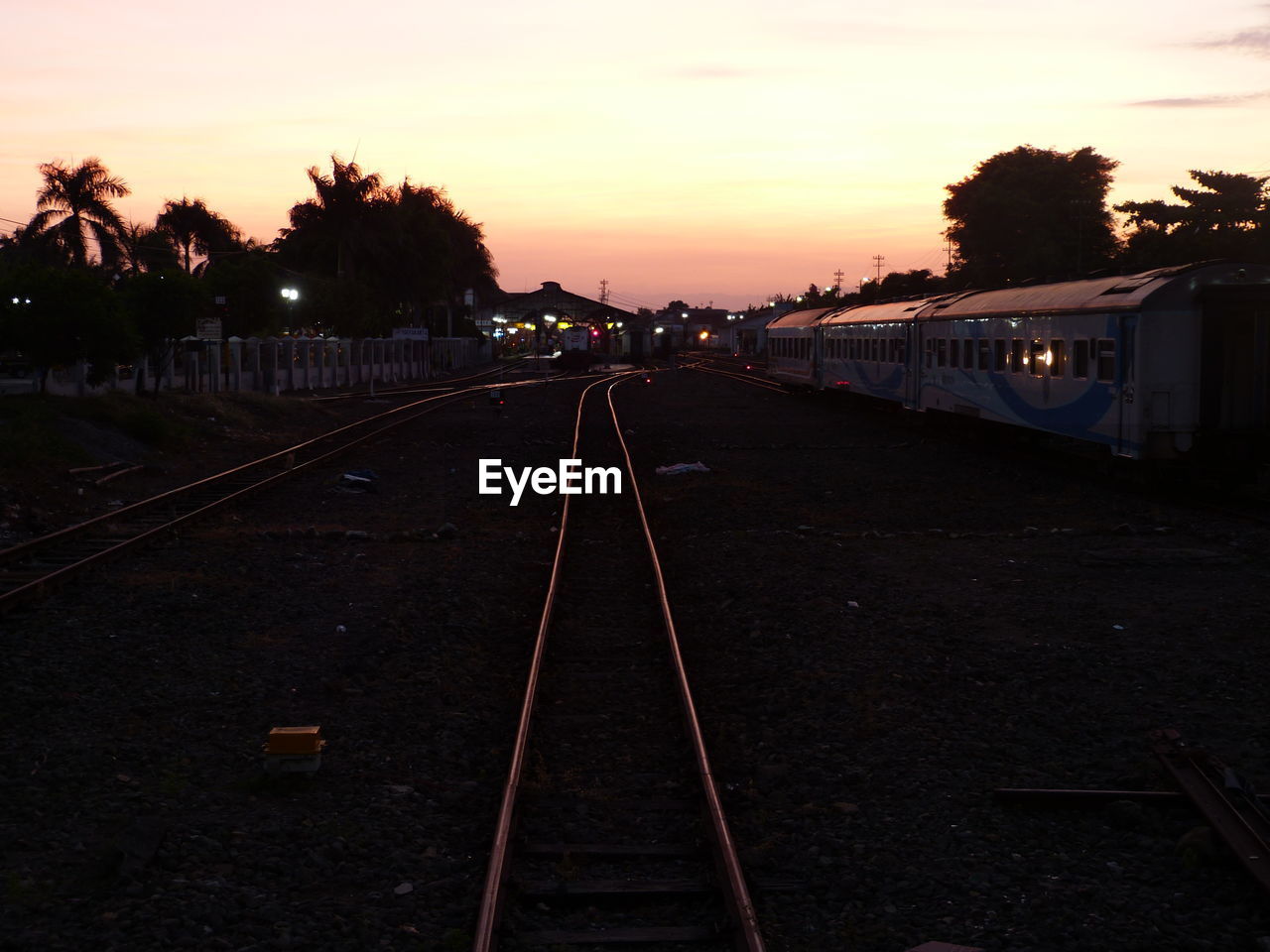 RAILROAD TRACKS AT SUNSET