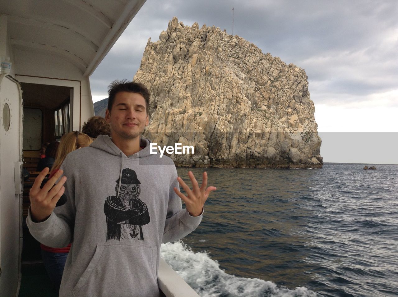 PORTRAIT OF MAN STANDING IN SEA