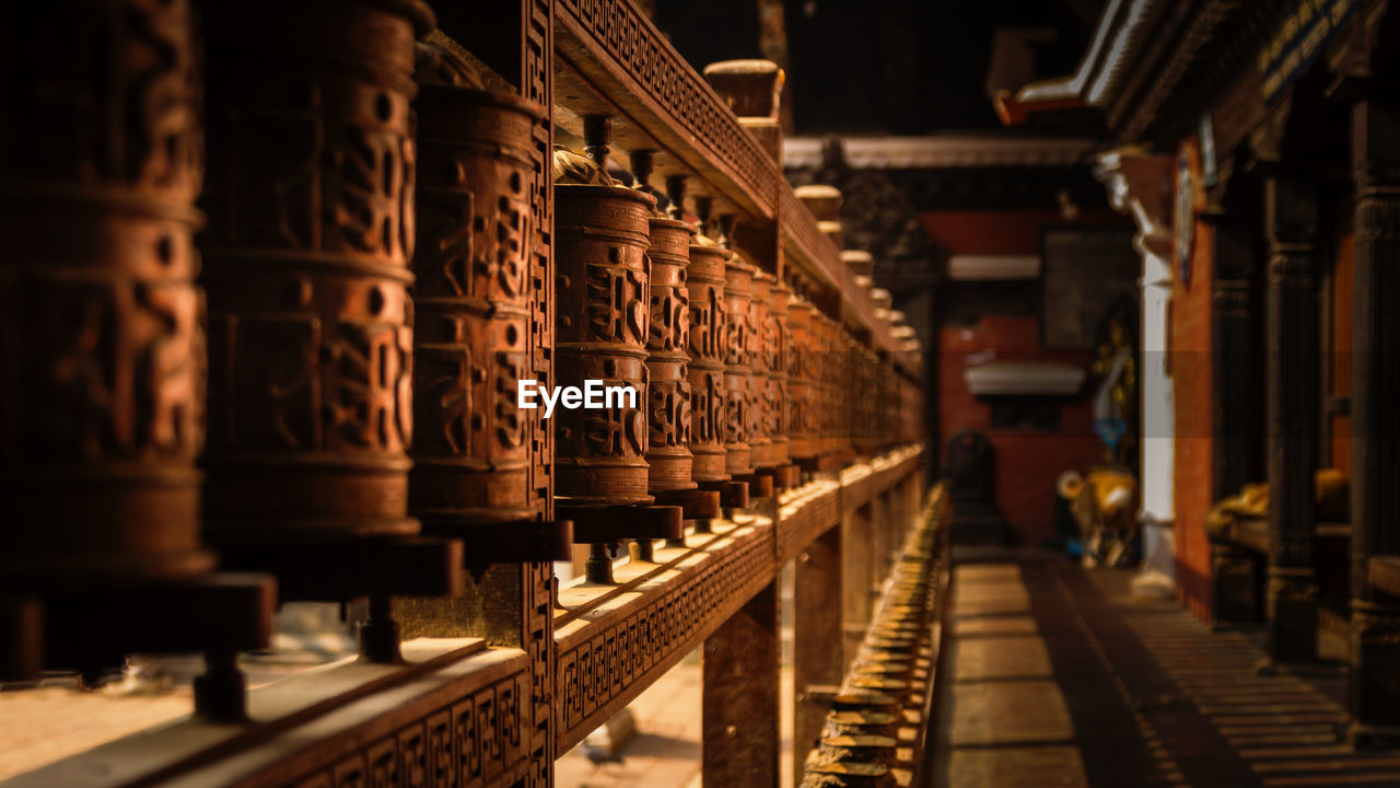 Row of wooden objects in temple