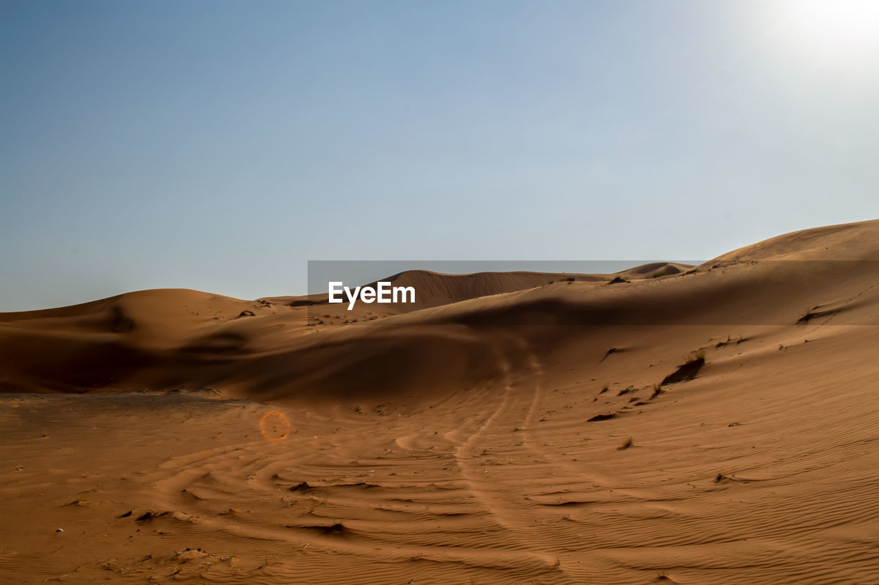 Scenic view of desert against clear sky